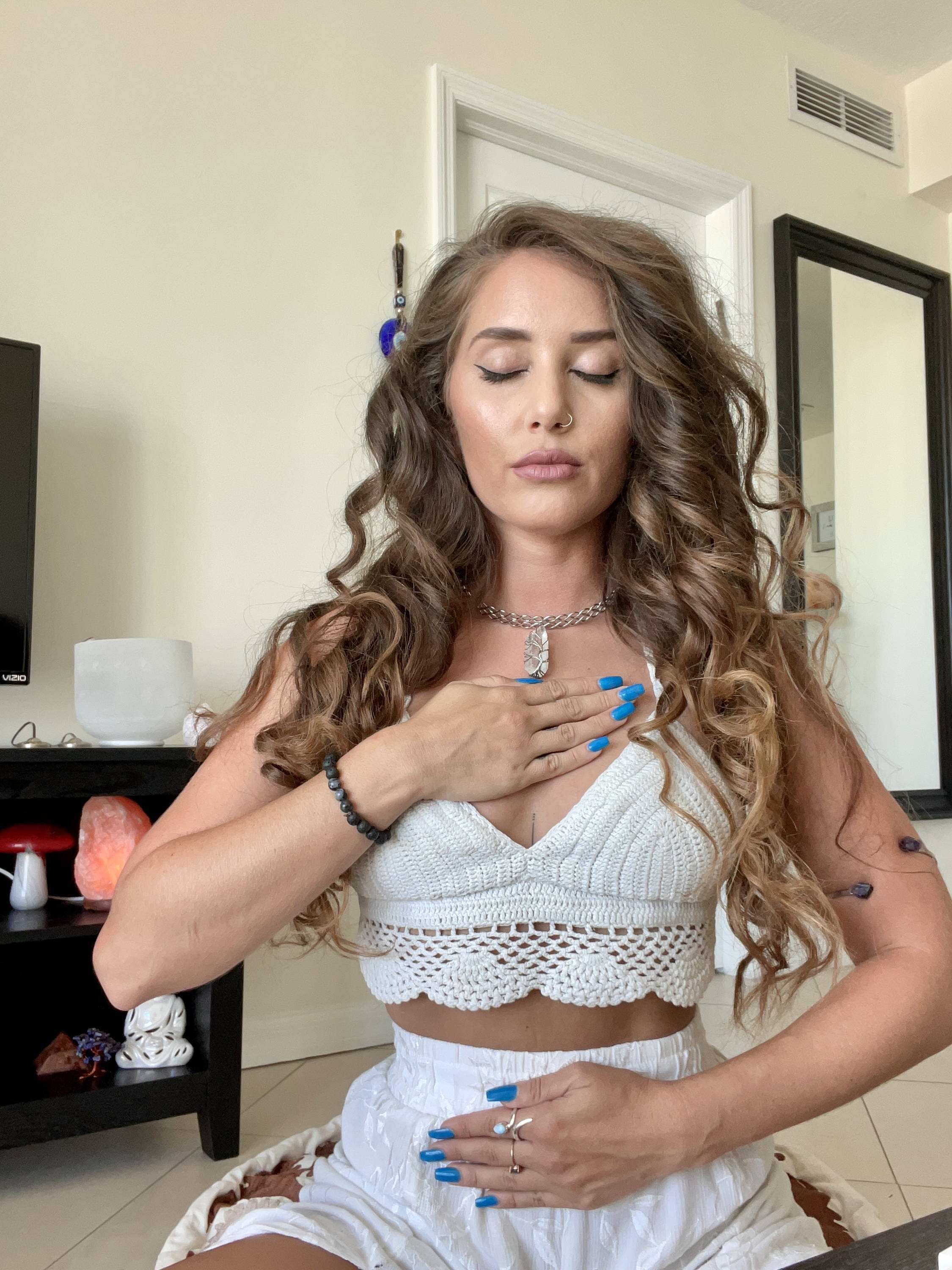 A girl doing yoga and showing her nail paints