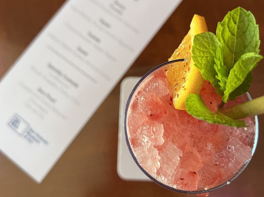 Image of a cocktail and menu