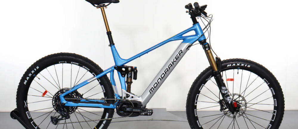 a blue and silver Mondraker Crafty RR electric bike
