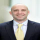 Eric Clarke makes seven big Orion hires that reflect the big check it wrote to Bain & Co. -- including a 'poach' from his brother, Todd