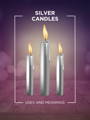 silver candles candle magiic 101 meaning icon with three lit candles and a purple and pink bokeh background