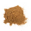 A pile of brown, finely ground powder scattered on a white background.