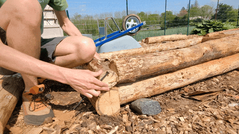 Screwing together the logs with timber screws.