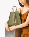 Model holding NOIRANCA handbag Grace in Olive Green