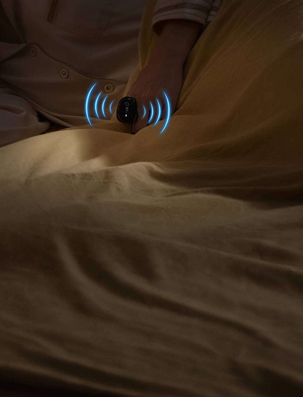 Person sleeping with Wellue O2RingS vibrating gently for low oxygen alert