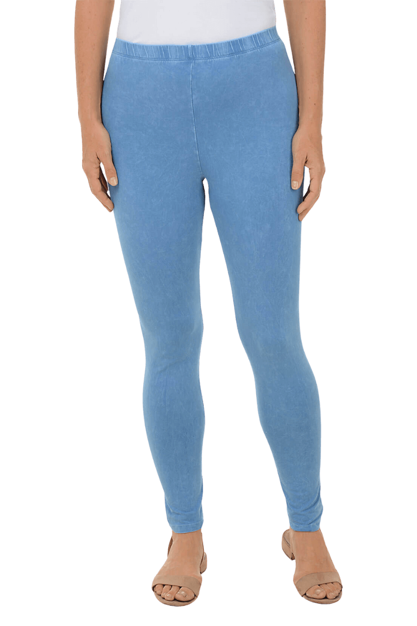 A woman wearing a light blue legging and neutral-colored sandals