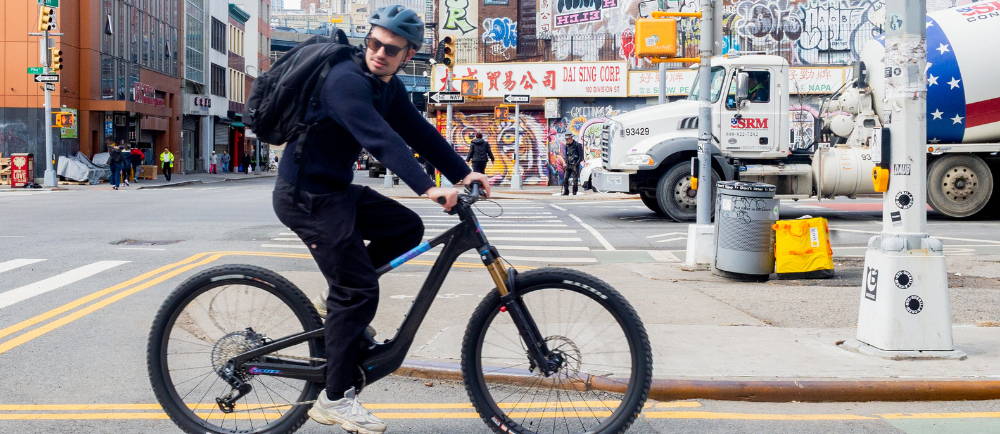 A man on an e-Bike in Chinatown