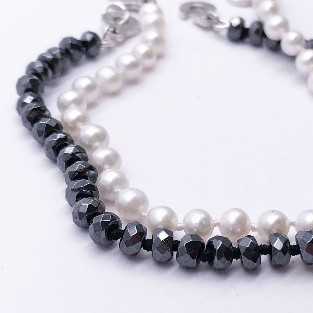 stringing black and white beads