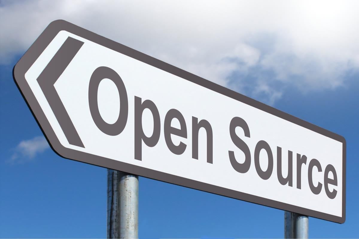 a road sign pointing to open source