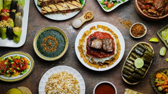 Arabic cuisine; Middle Eastern traditional lunch. It's also Ramadan 'Iftar'. The meal eaten by Muslims after sunset during Ramadan. Assorted of Egyptian oriental dishes. Top view with close up.