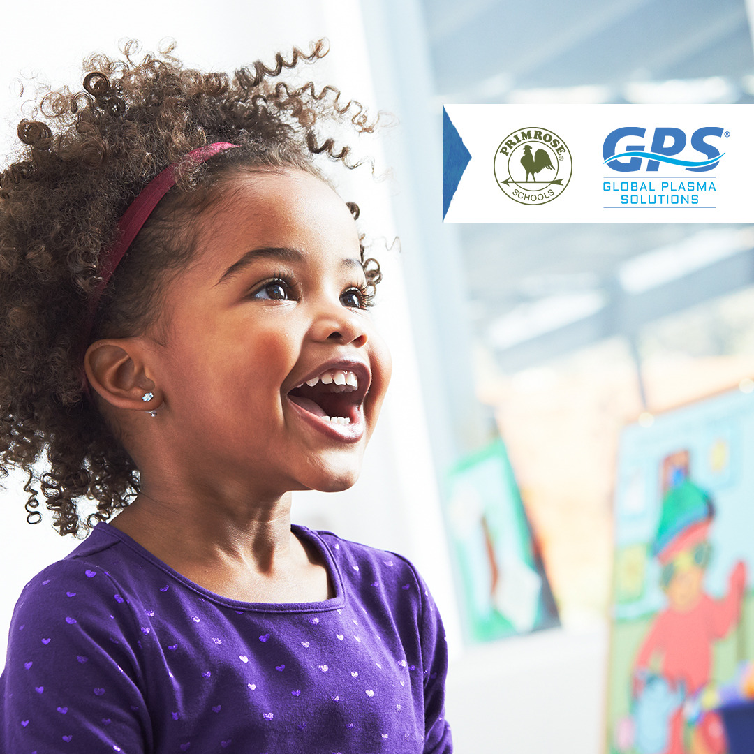 Child smiling with Primrose and GPS logos