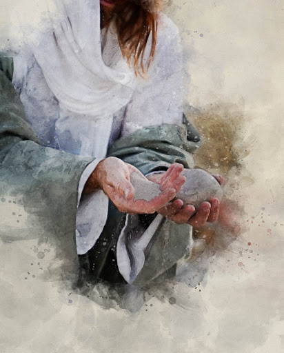 Jesus holding a stone in one hand and sand in another hand. 