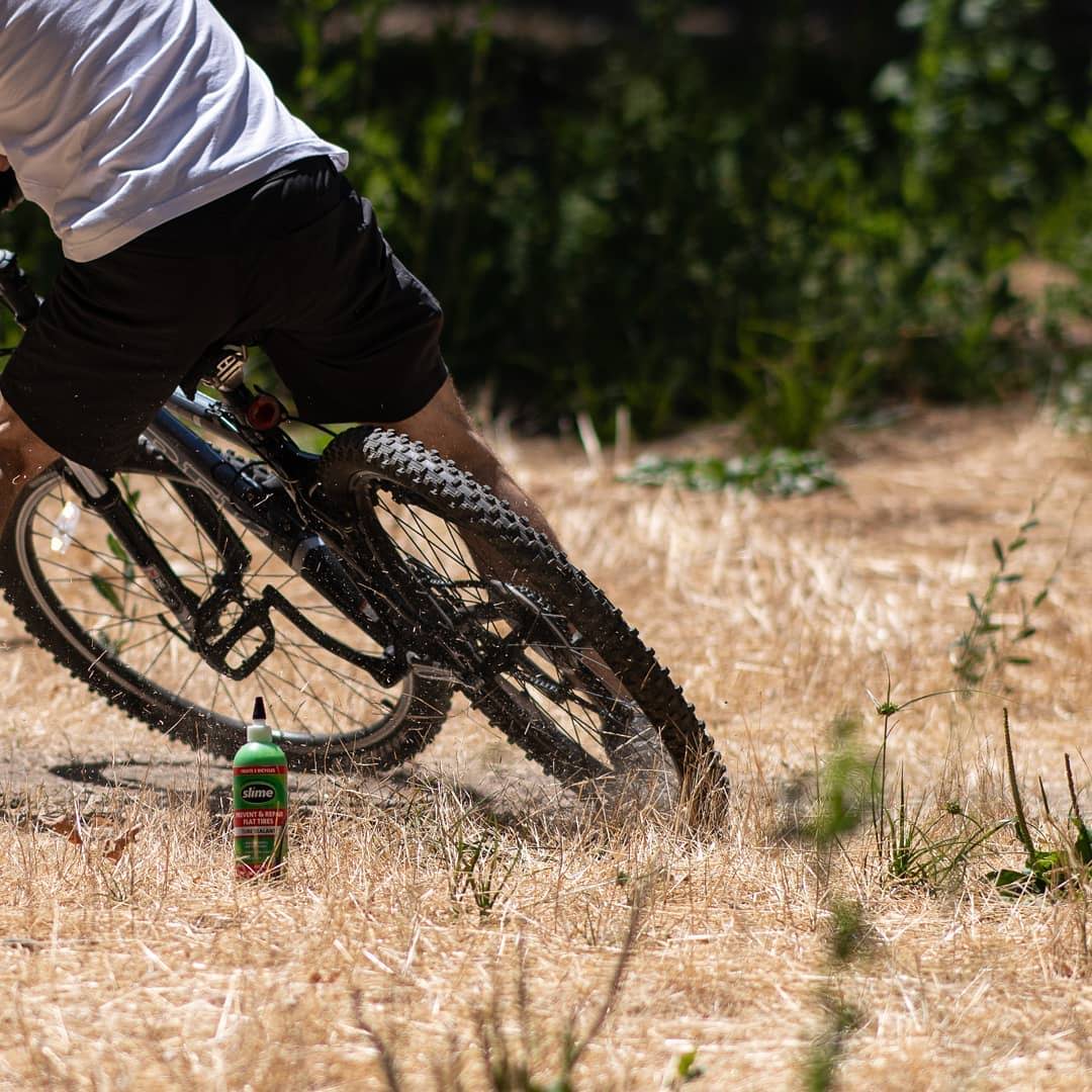 Mountain Biker in field with Sime Tube Sealant