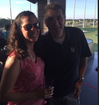 Karen Lisowski of Black Diamond and Dave Ireland of Salentica at the driving range.