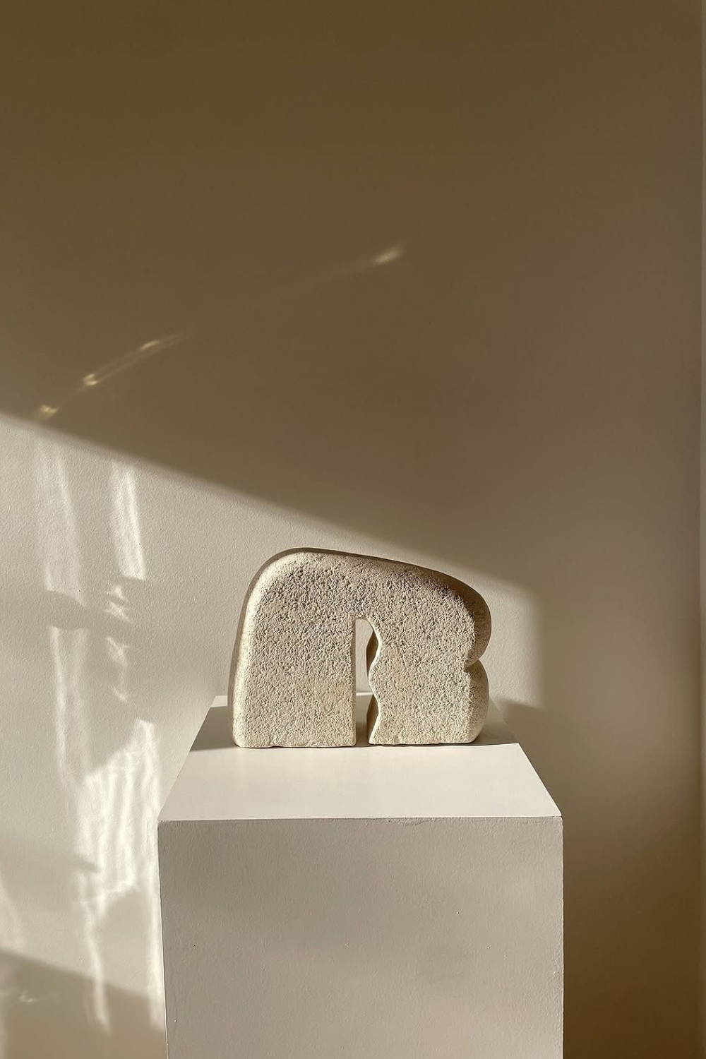 Gilani Collection Sculpture Art by Evelyn Michaelides - Hand-carved, organic-shaped limestone sculpture art.