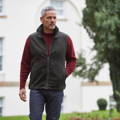 dark olive Berwick waistcoat over red crew neck sweater