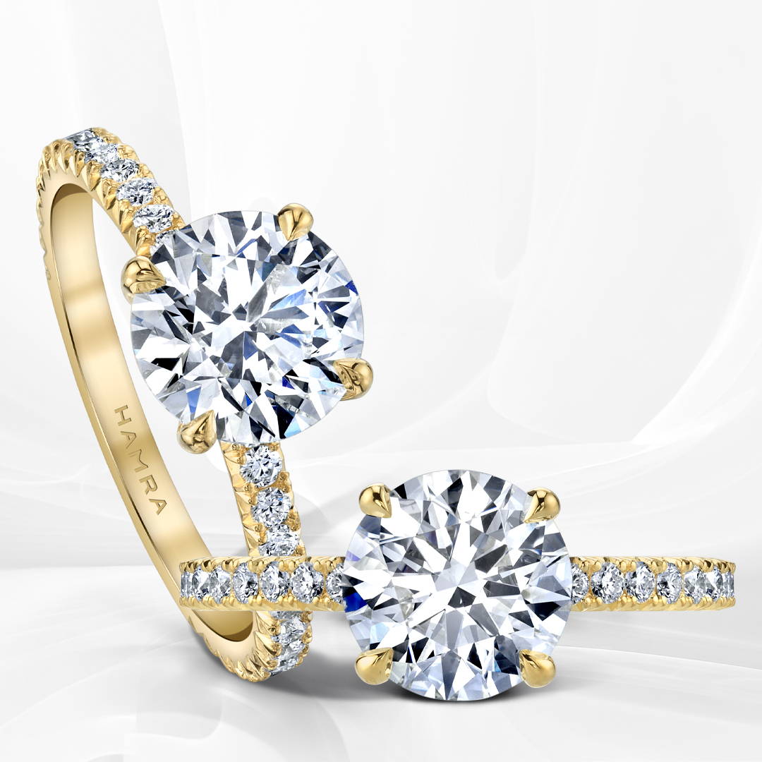 Two solitaire rings in yellow gold with round brillant cut diamonds.