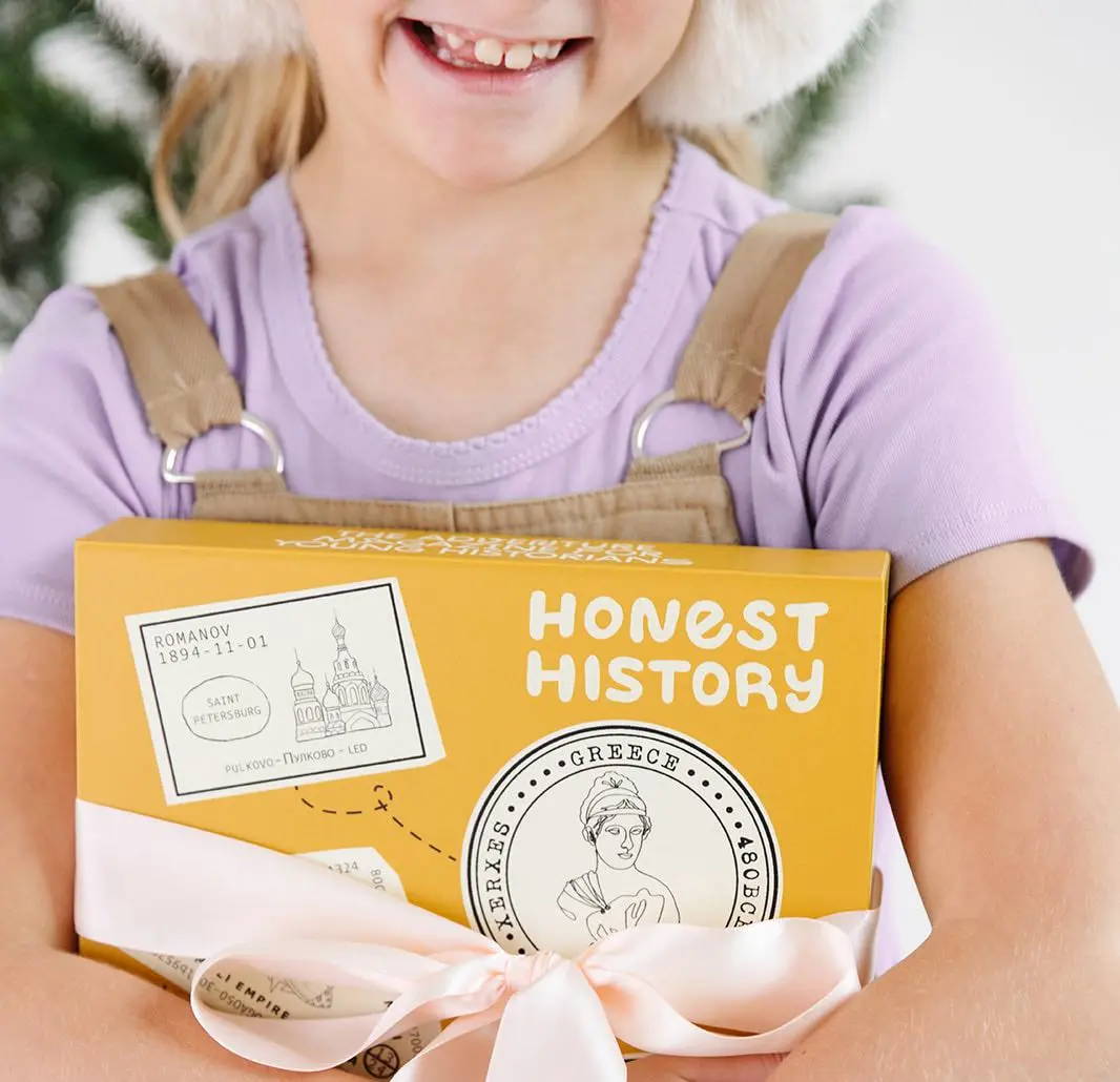 girl holding capsule collection 3 honest history