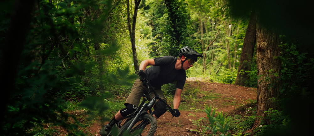 A mountain biker riding a trail in the forest
