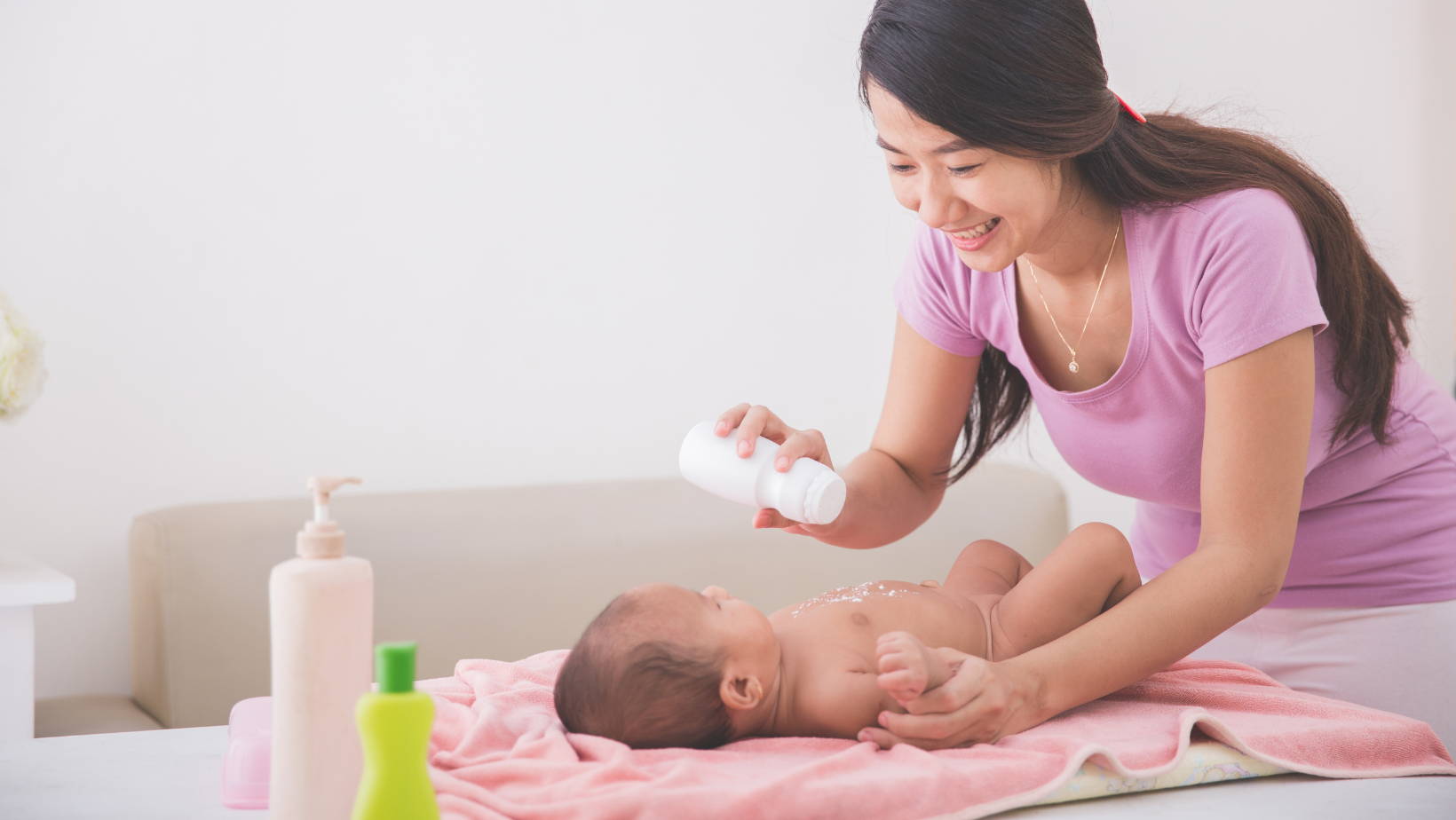 Mom putting baby powder on baby | My Organic Company