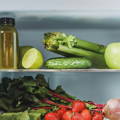 Fridge containing perishable fruits and vegetables.