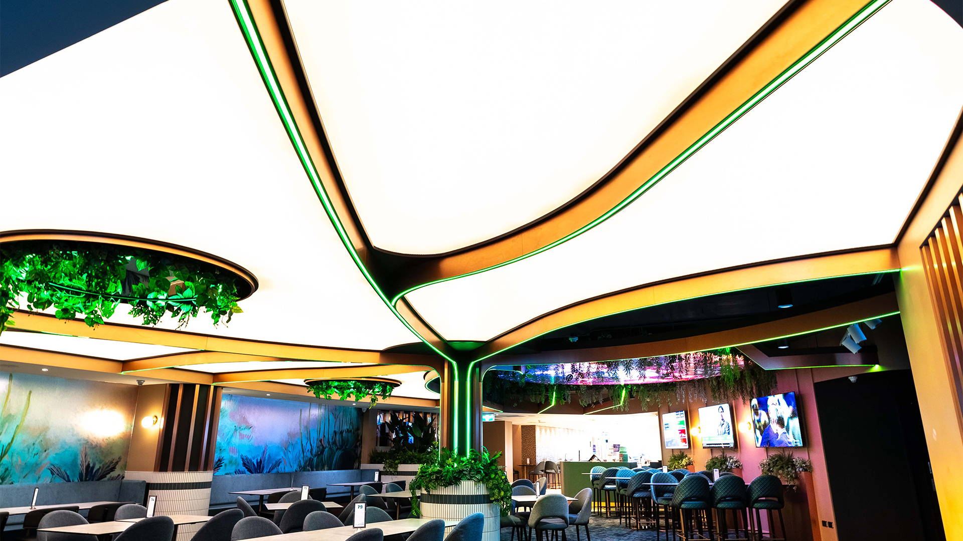 Ceiling illuminated brightly with the help of LED Panels from Havit Commercial. RGBCW LED bendable Strip Lighting is also present in green