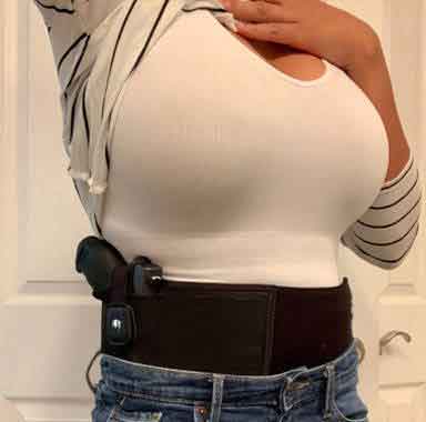 a female customer using dragon belly holster take a selfie