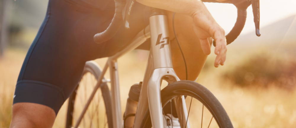 a cyclist crouched over an electric road bike