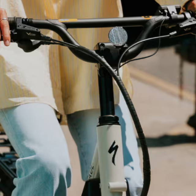 a woman riding a specialized globe haul electric cargo bike