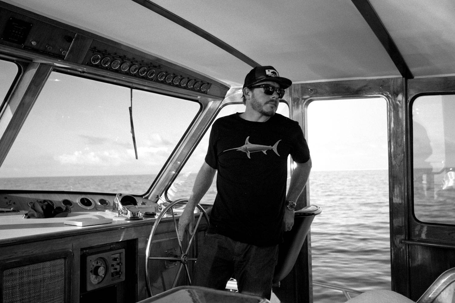 An Image of Thos Carson the owner on his boat.