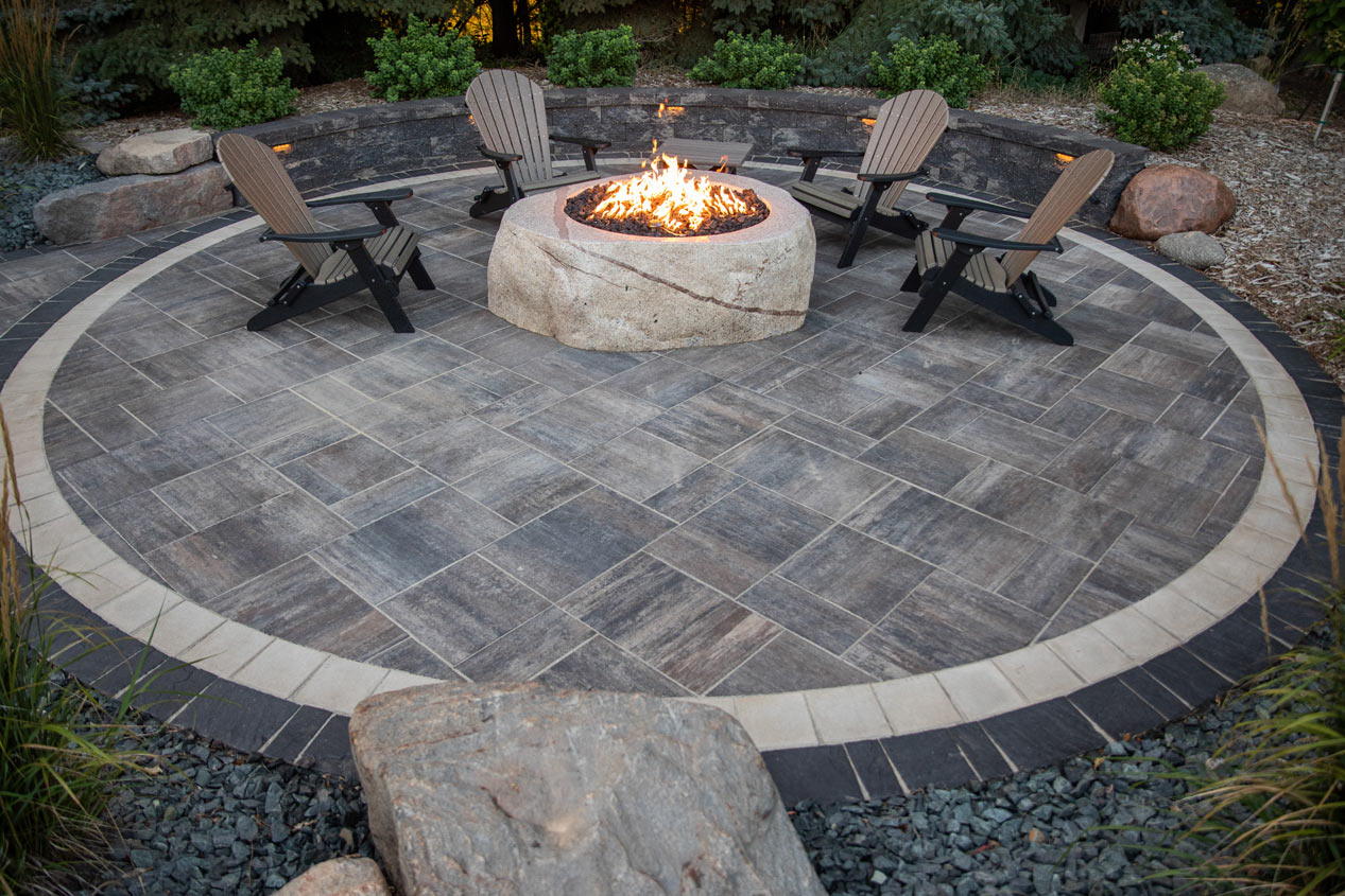 Grand Discover Patio with double border with a fire pit and seating.