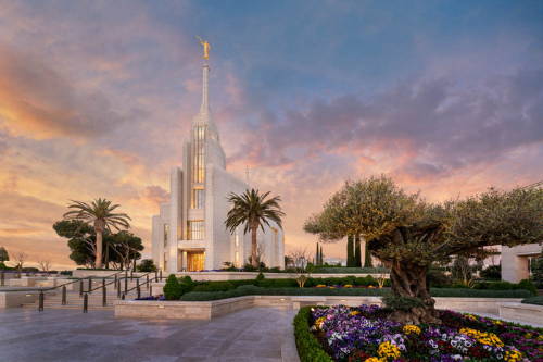 Rome Temple picture with flower beds and a distant sunset.