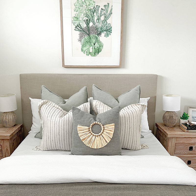 Bed styling with a classic style accent cushion, featuring a splash of Boho influence