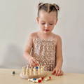 Three year old girl playing with a Montessori Memory Match game.