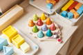 Colorful Montessori toys on a shelf.