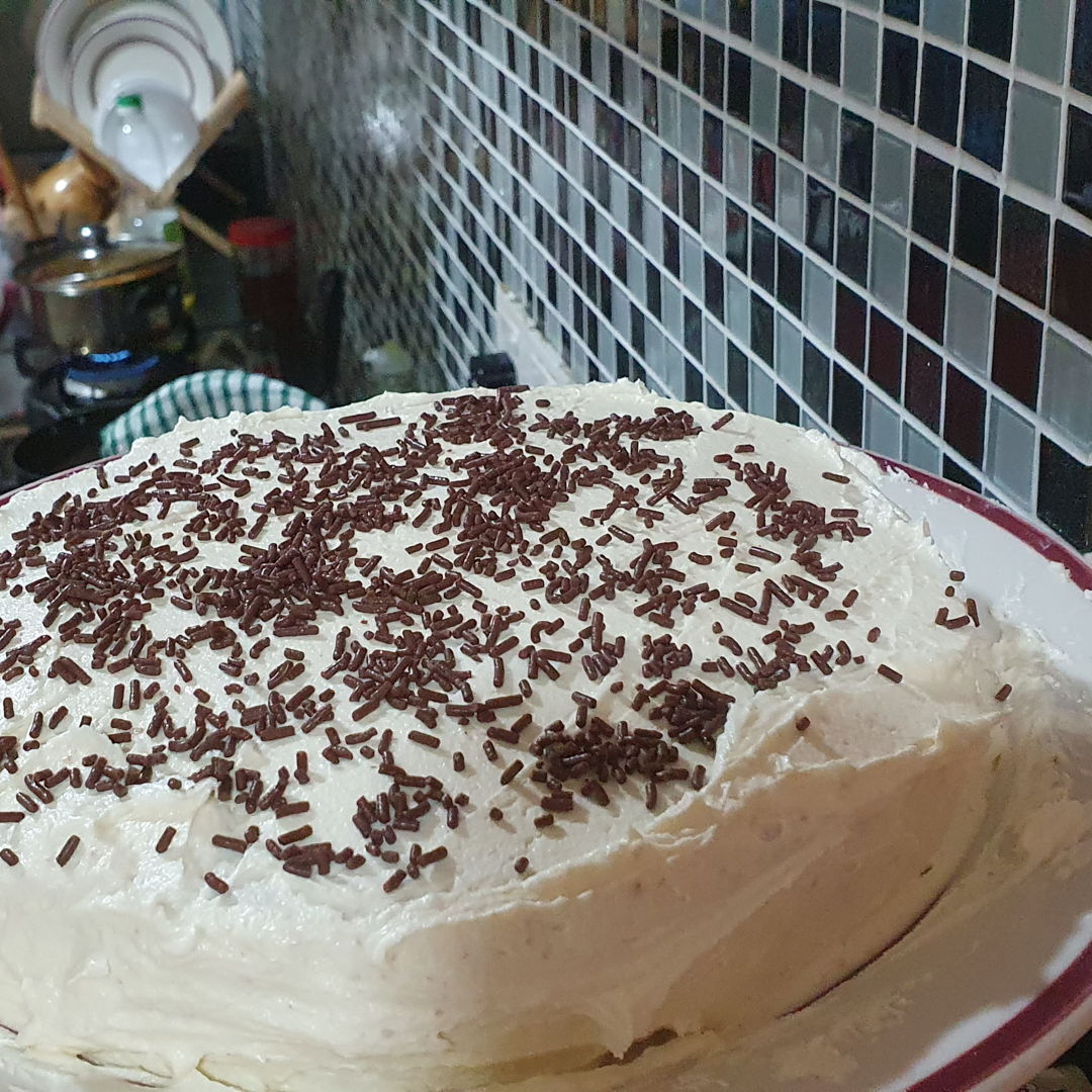 Vanilla cake with buttercream icing and chocolate rice topping