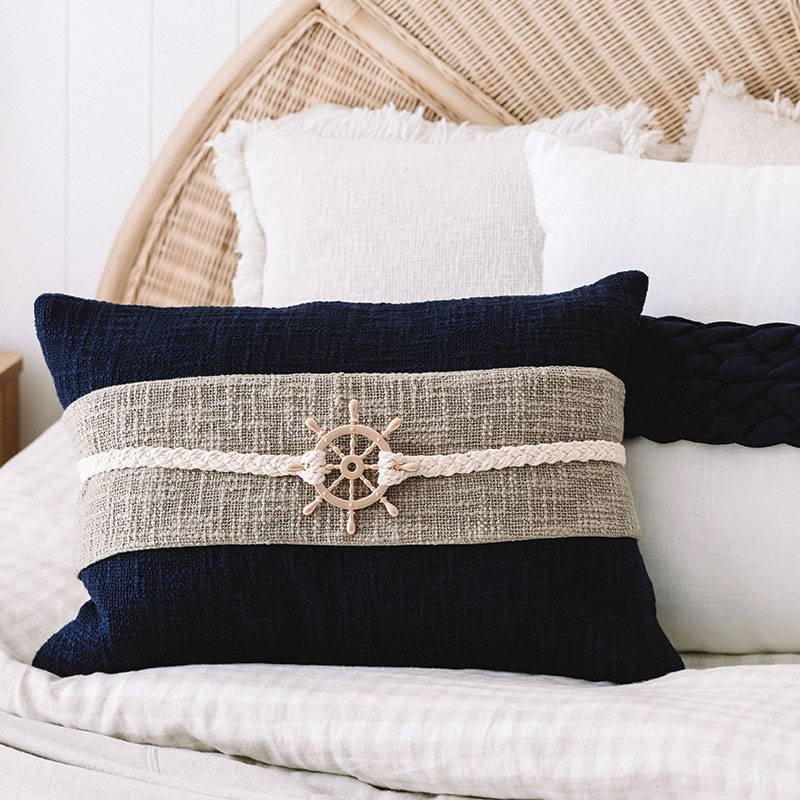 Navy Coastal Cushion with Sailor's Wheel Accent - Ideal for enhancing your coastal home.