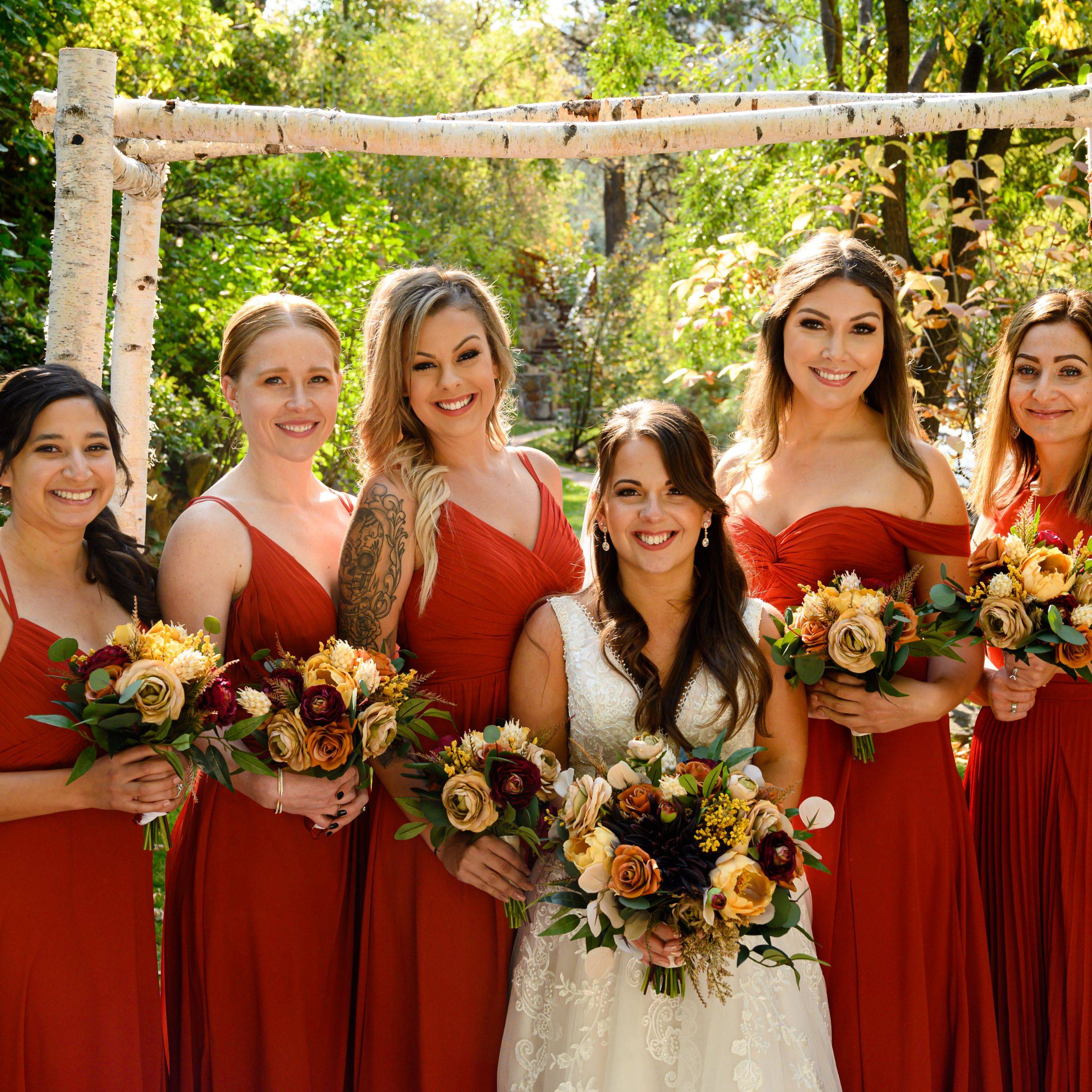 Bright fall wedding bouquets with yellow, rust, burgundy and tan flowers 