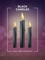 black candles candle magiic 101 meaning icon with three lit candles and a purple and pink bokeh background