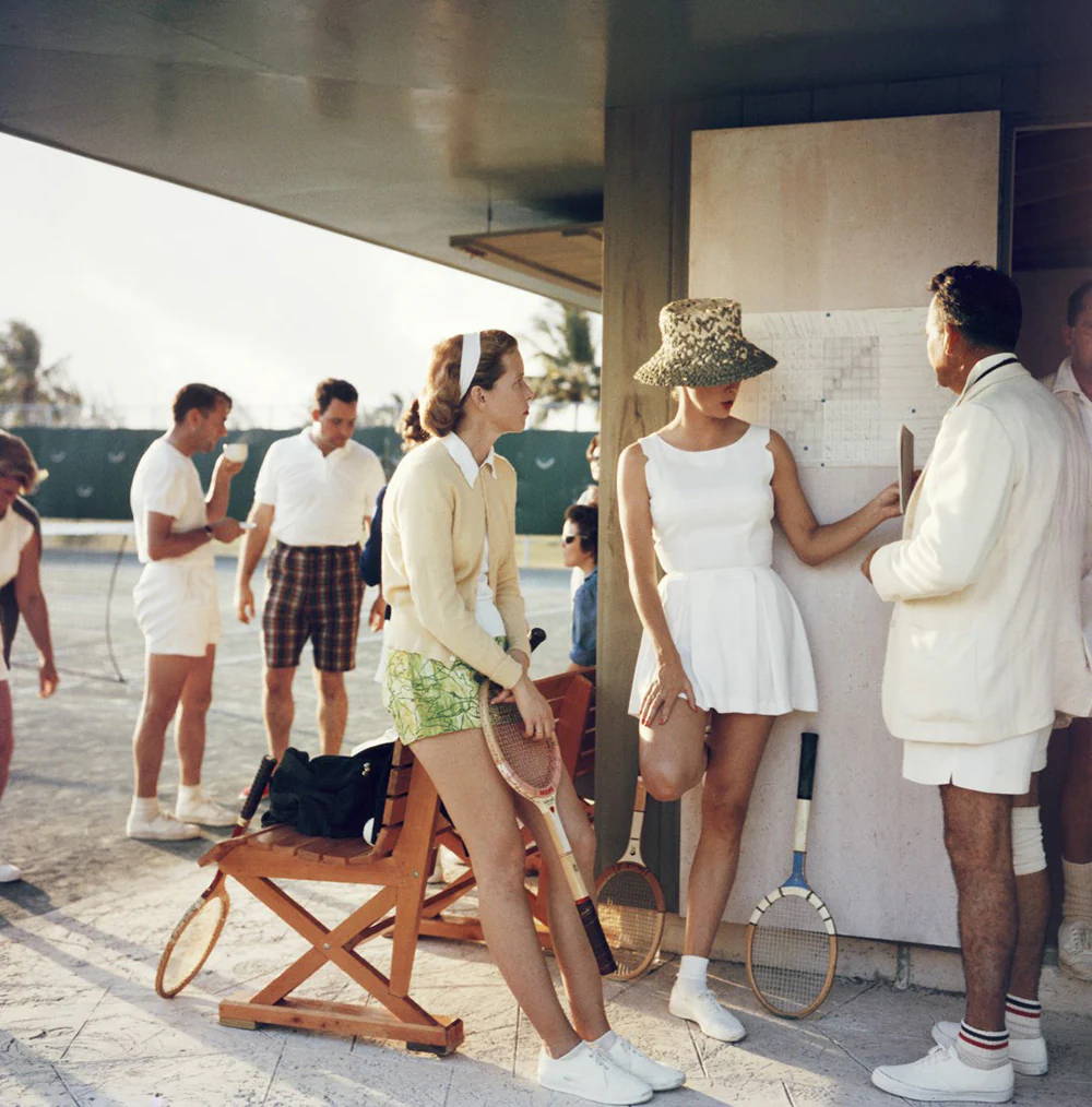 Tennis in the Bahamas by Slim Aarons – A photographic print capturing a tennis scene at an exclusive club in the Bahamas