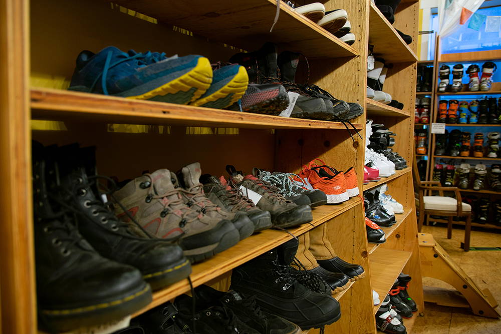 Shelves full of used footwear.
