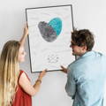 young couple hanging fingerprint guest book