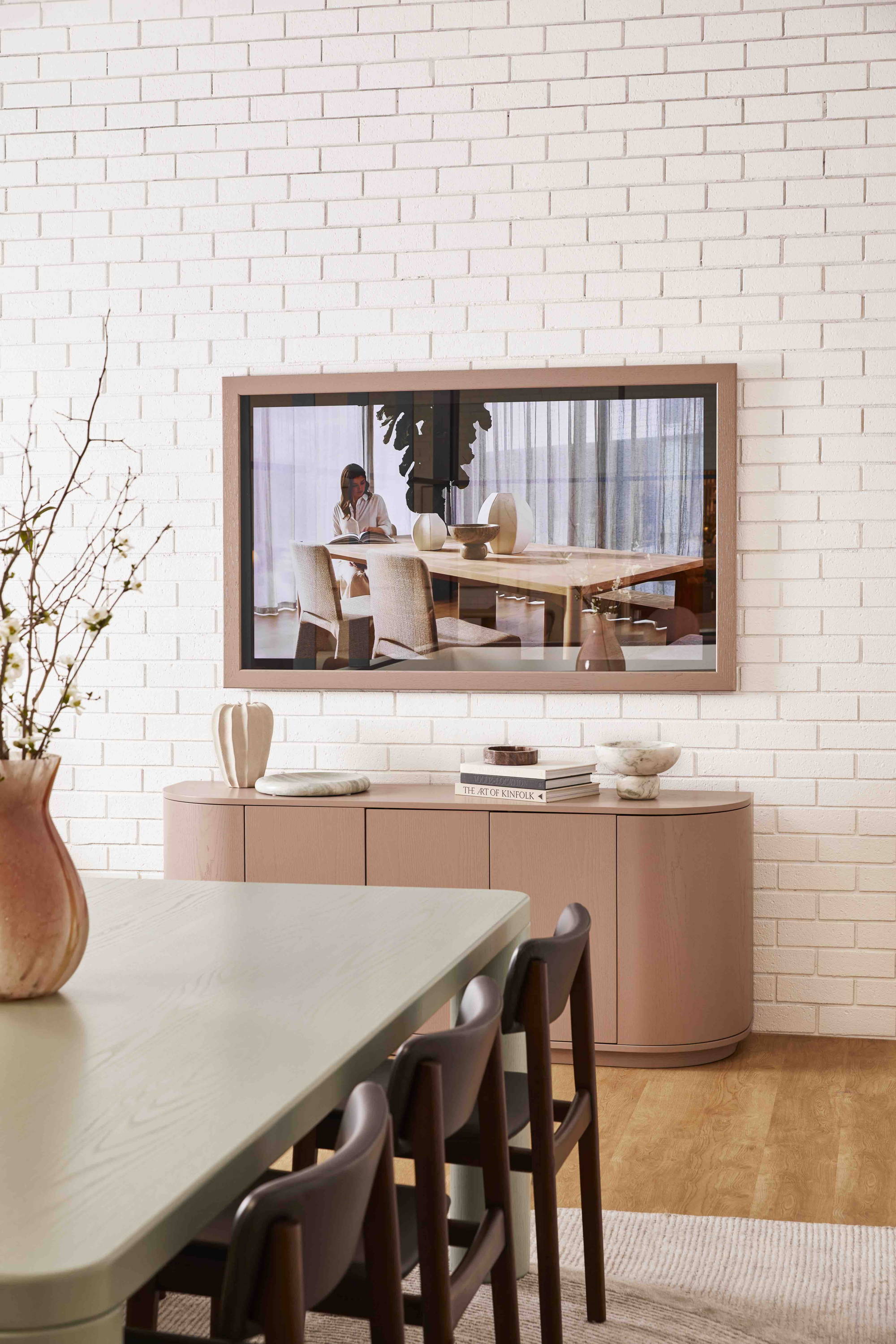 Custom Pink Frame TV-Mirror by FRAMING TO A T - A pink TV-Mirror frame in a living room setting.