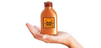 A bottle of a personal care product exhibiting a danger sign.