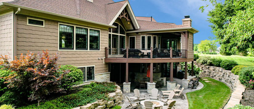 back of house with a lawn