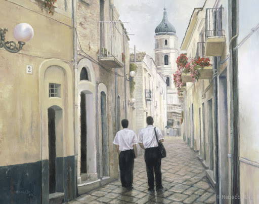Two LDS missionaries walking down a narrow road.