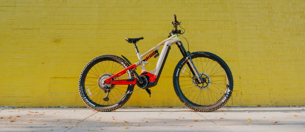 Cannondale Moterra LT electric mountain bike in front of yellow wall