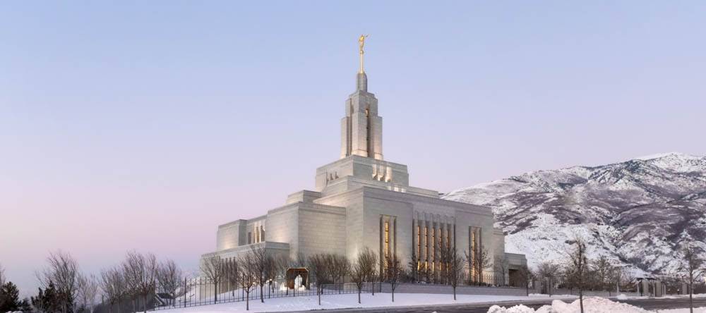 Photo of Draper Utah LDS Temple with snowy mountains in the background.
