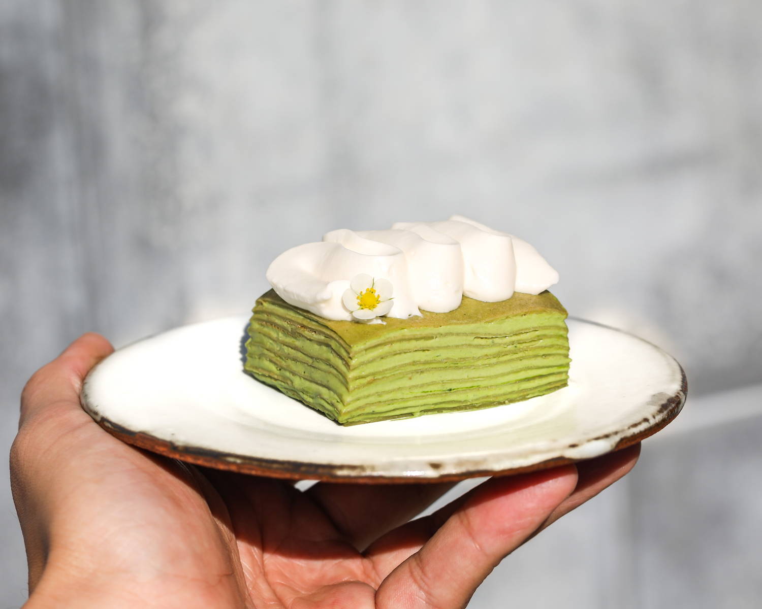 Cuzen matcha crepe cakes layered with matcha whipped cream by SingleThread