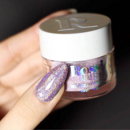 Liquid, Nail polish, Cosmetics, Purple, Finger, Violet, Material property, Body jewelry, Nail, Glitter